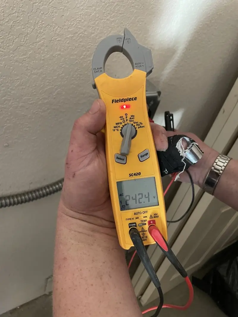 Voltage testing with clamp meter during Electrical Installation Services in River Falls